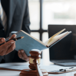 Debt attorney consulting with client while reviewing legal documents