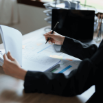 Professional reviewing court costs to take someone to court for debt with legal documents