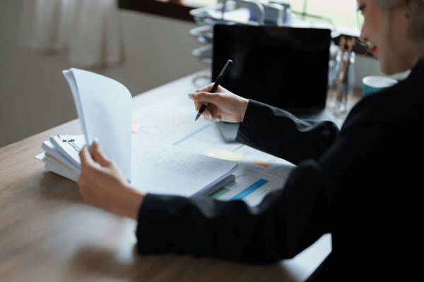 Professional reviewing court costs to take someone to court for debt with legal documents