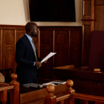 Hiring a criminal defense attorney - lawyer presenting case before judge in courtroom