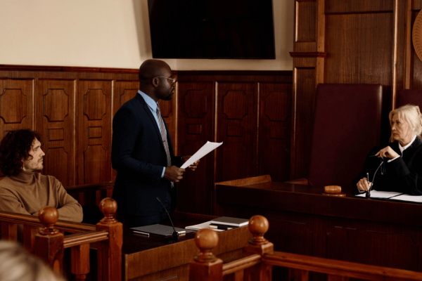 Hiring a criminal defense attorney - lawyer presenting case before judge in courtroom