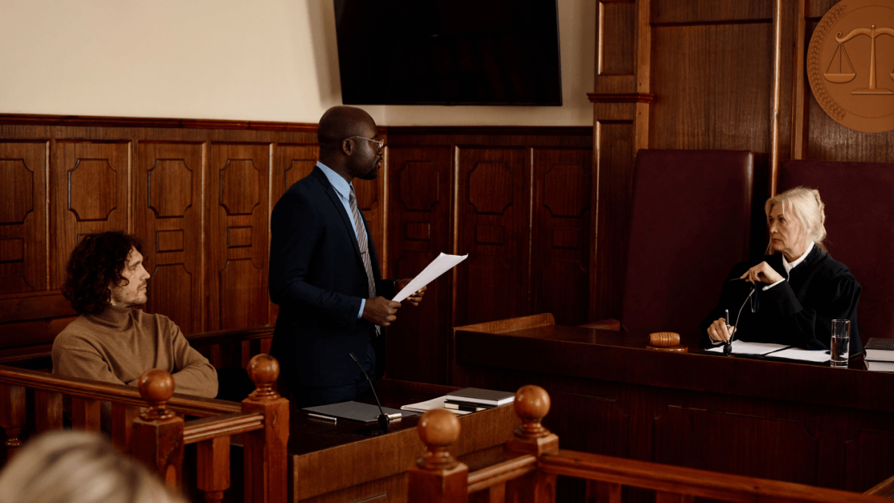 Hiring a criminal defense attorney - lawyer presenting case before judge in courtroom
