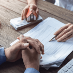 Person reviewing debt documents with calculator learning how long before a debt becomes uncollectible