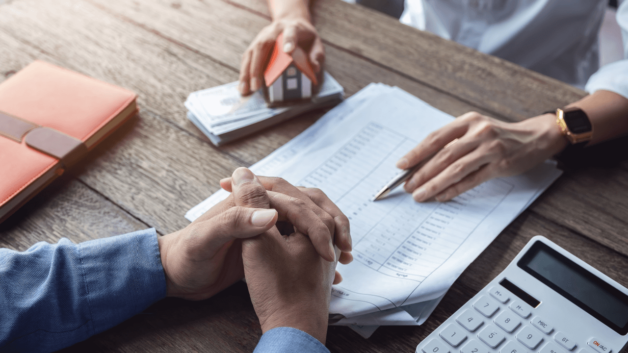 Person reviewing debt documents with calculator learning how long before a debt becomes uncollectible