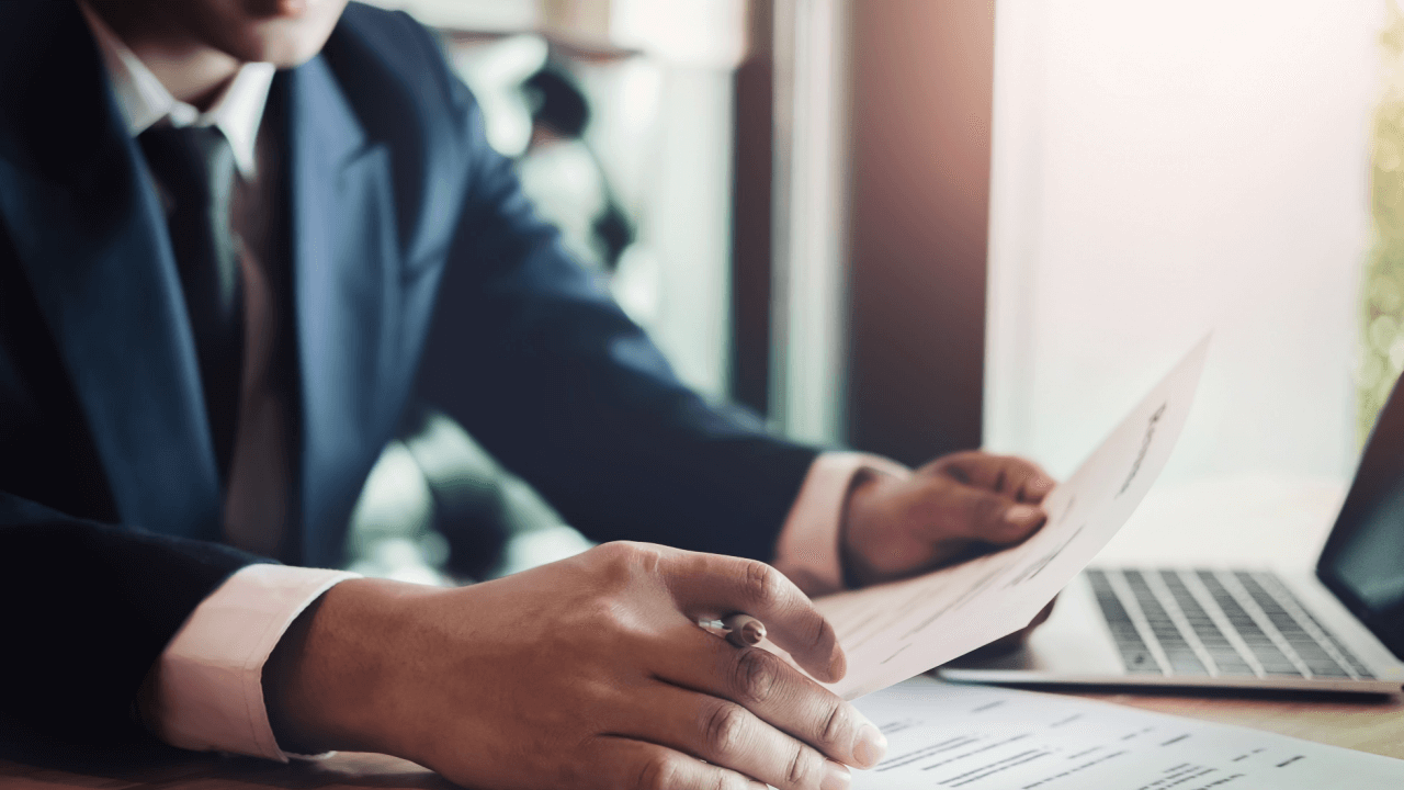 Professional reviewing debt collection lawsuit documents to understand how much debt collectors sue for