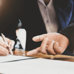 Attorney explaining what are the cons of debt settlement to client during consultation