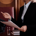 Defense lawyer presenting evidence in courtroom explaining what is the role of a defense lawyer in a criminal case