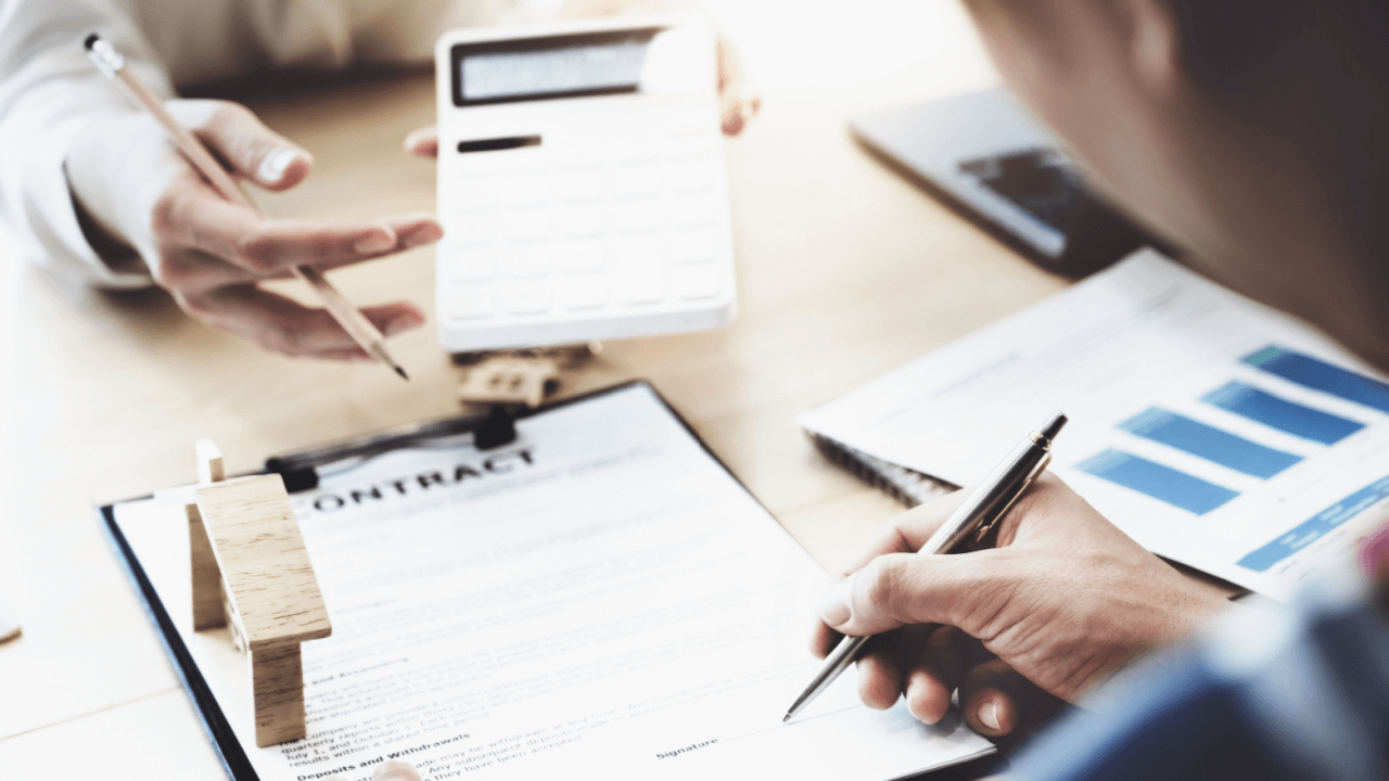 Person reviewing debt collector correspondence and contract documents to understand what is the worst thing a debt collector can do