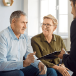 When should I hire a criminal defense attorney consultation meeting with couple and lawyer