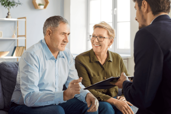 When should I hire a criminal defense attorney consultation meeting with couple and lawyer