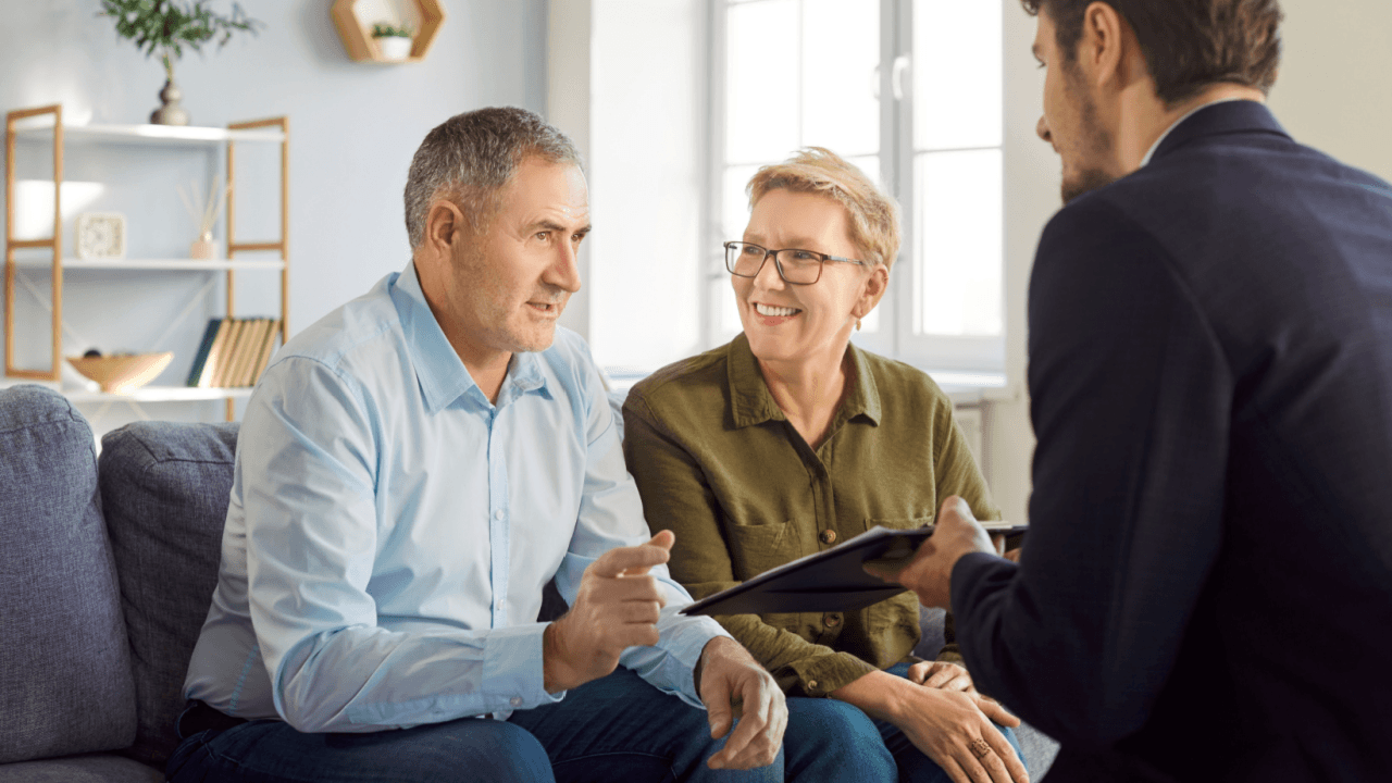 When should I hire a criminal defense attorney consultation meeting with couple and lawyer