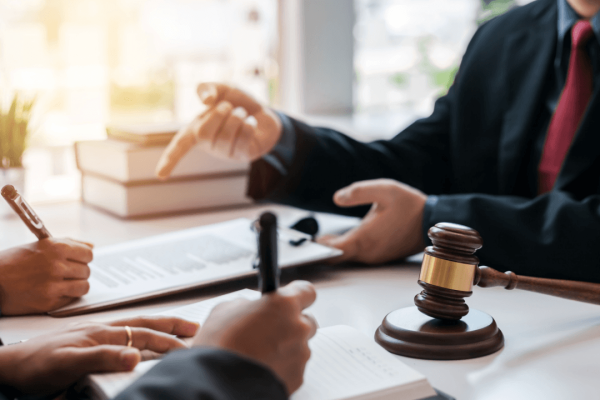 Criminal defense lawyer helping client understand how does a criminal defense lawyer help me during legal consultation