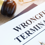Wrongful termination legal document with gavel on desk