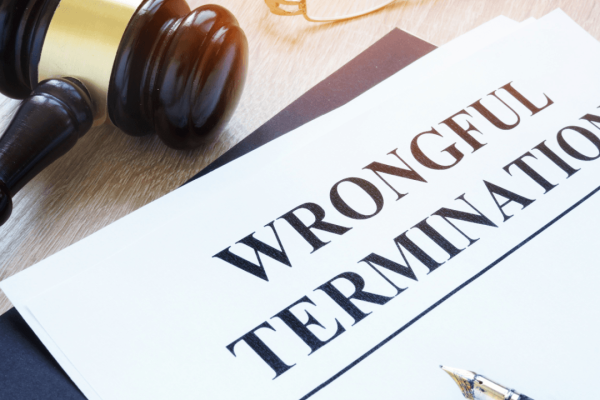 Wrongful termination legal document with gavel on desk