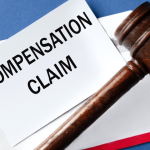 Wrongful termination compensation claim document with judge's gavel on blue background