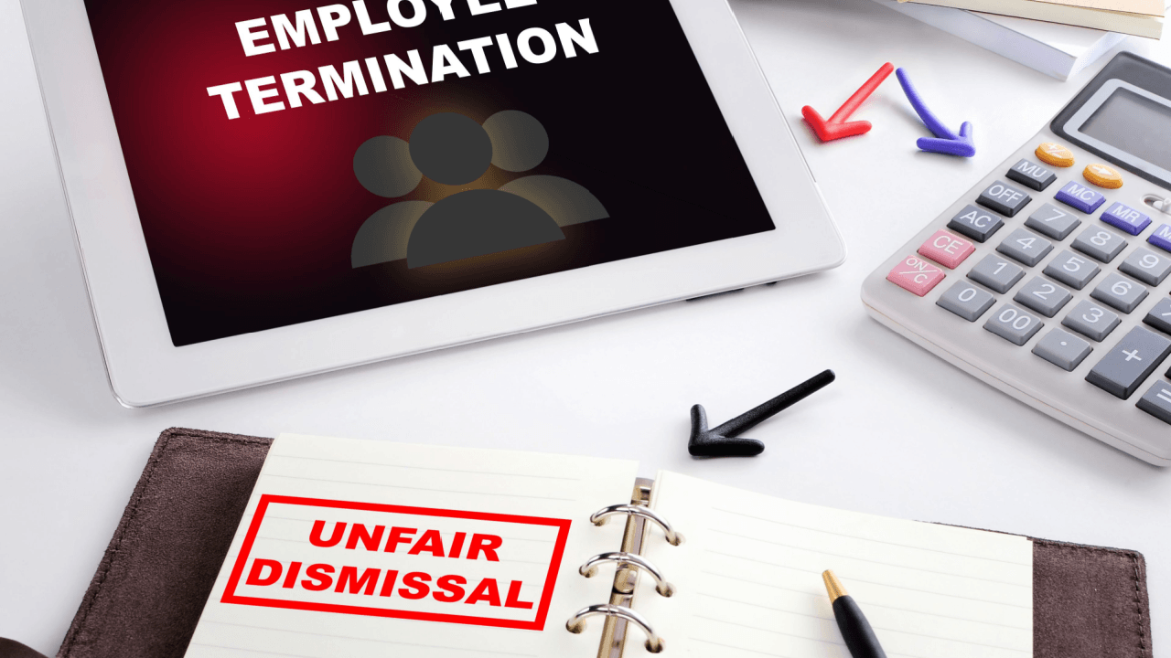 Fight unfair termination and unfair dismissal concept with tablet and notebook