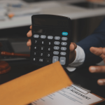Attorney reviewing termination settlement calculations with client