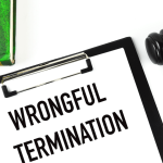 Wrongful termination clipboard with gavel and law book