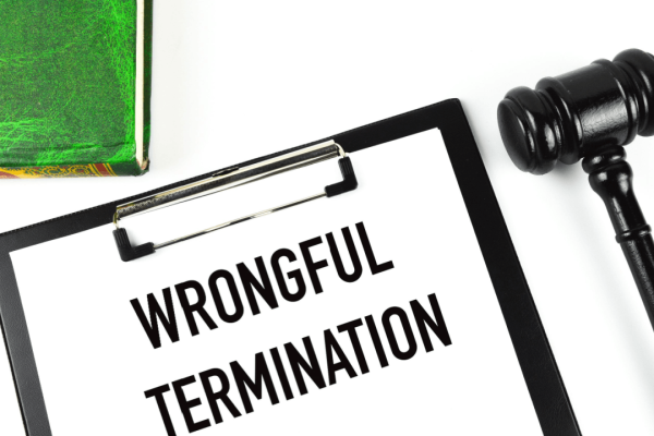 Wrongful termination clipboard with gavel and law book
