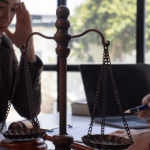 Distressed employee meeting with attorney about retaliation after filing an EEOC complaint