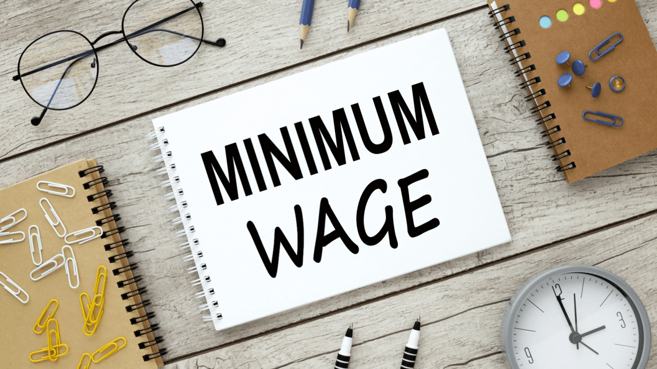 Notebook displaying minimum wage text representing minimum wage violation claims workers can file