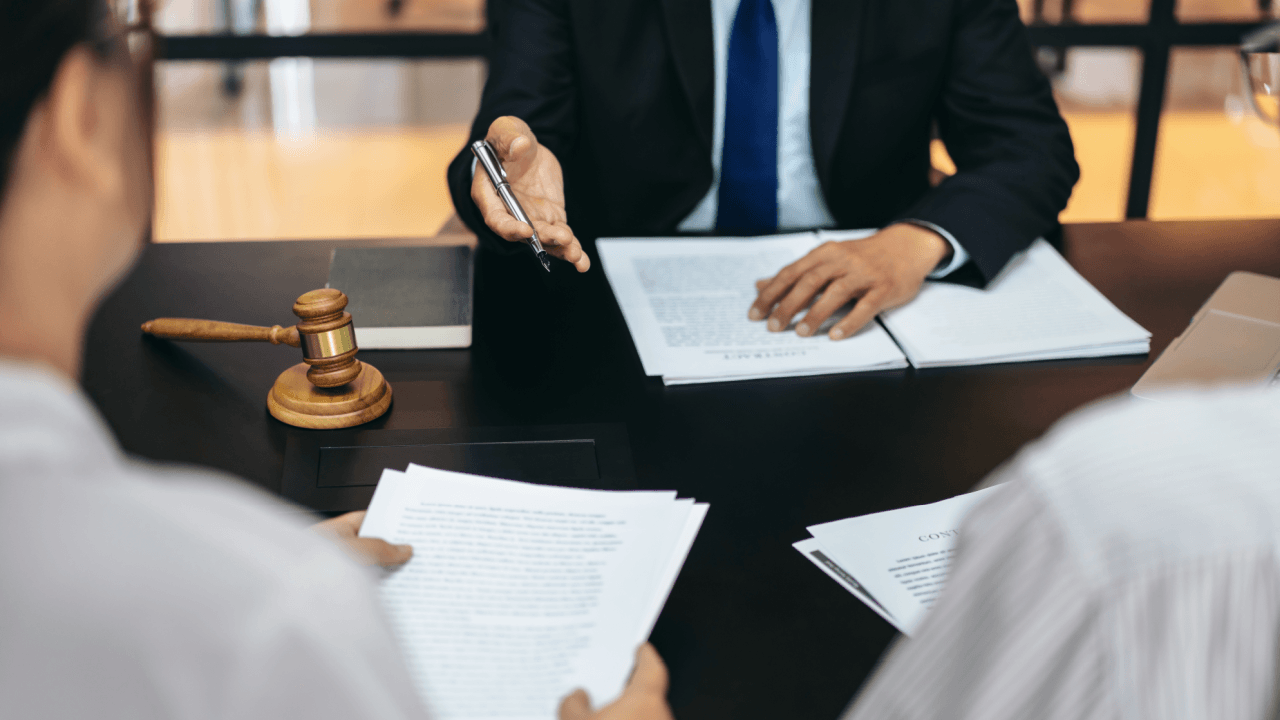Attorney explaining what creates a hostile work environment during legal consultation with client